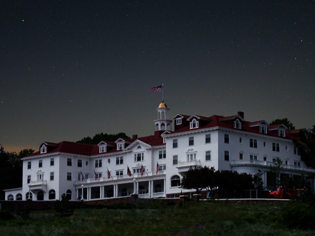 The Stanley Hotel in Estes Park, Colorado, would be my cabin in the woods to escape market fundamentals for the next year -- if I could. (The Stanley Hotel by Darin Newsom; night sky by Merritt Boyd, cc by-sa 2.0)